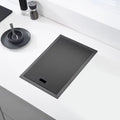 Modern bathroom sink with sleek faucet and digital control panel.